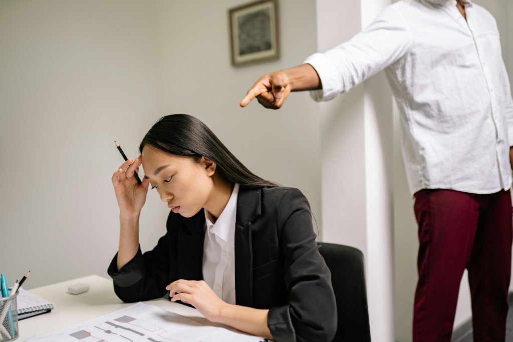 woman working with someone pointing at her